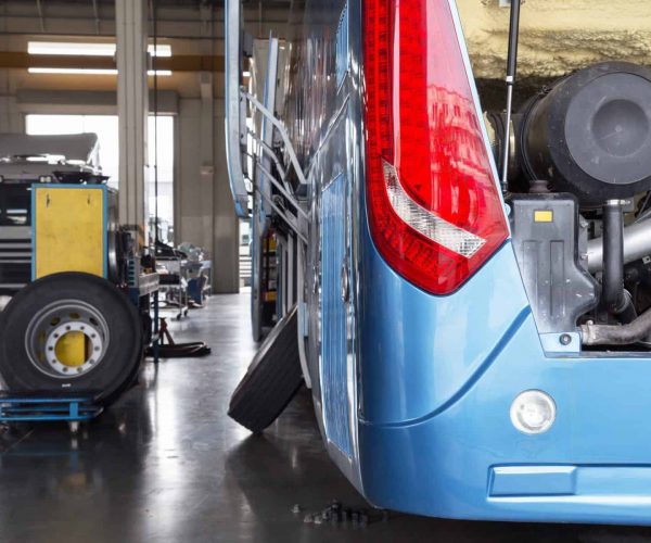 bus and truck waiting for service in the garage